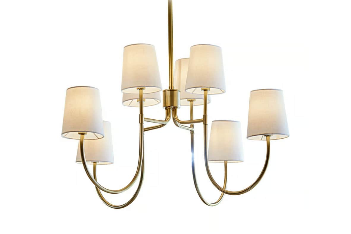 The image displays a contemporary chandelier featuring a brass-finished frame and multiple individua… — 3D model
