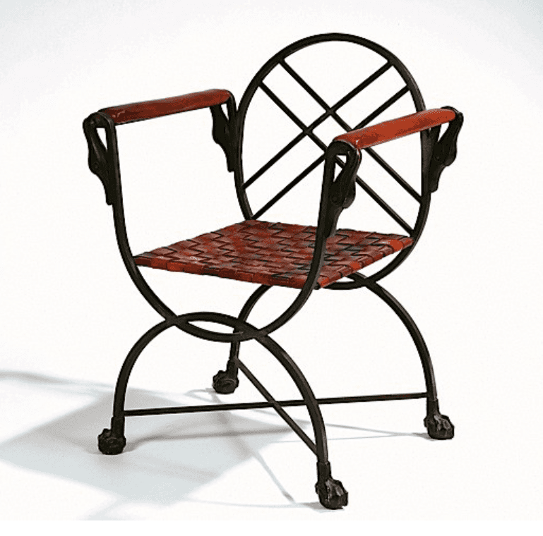 An armchair with a dark wrought iron frame, featuring an X-shaped base and curved supports. The seat… — 3D model