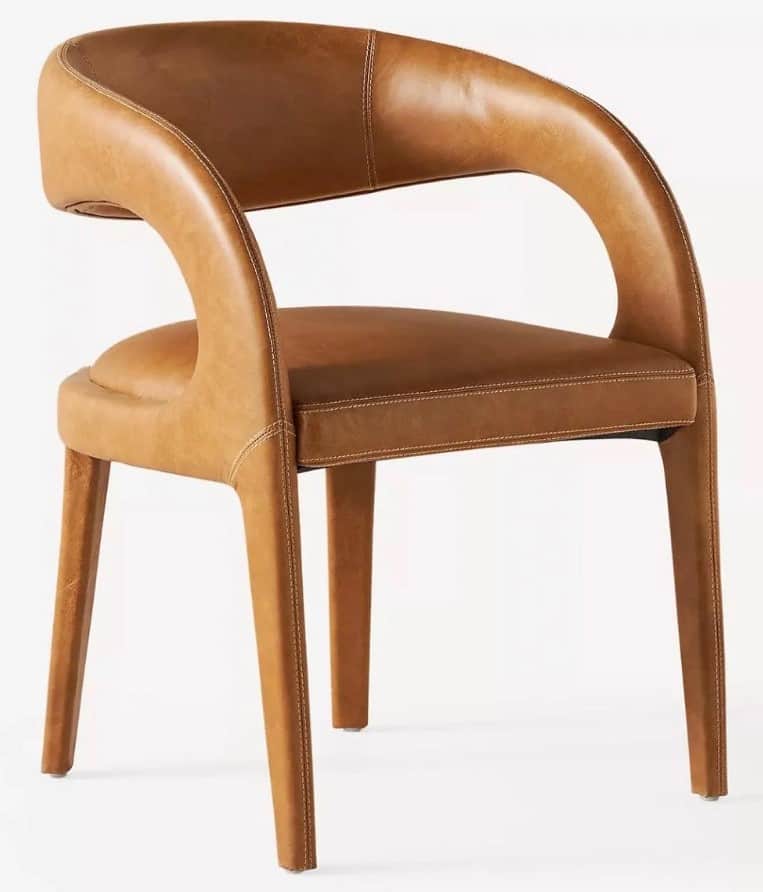 A contemporary armchair fully upholstered in cognac brown leather, featuring an integrated curved ba… — 3D model