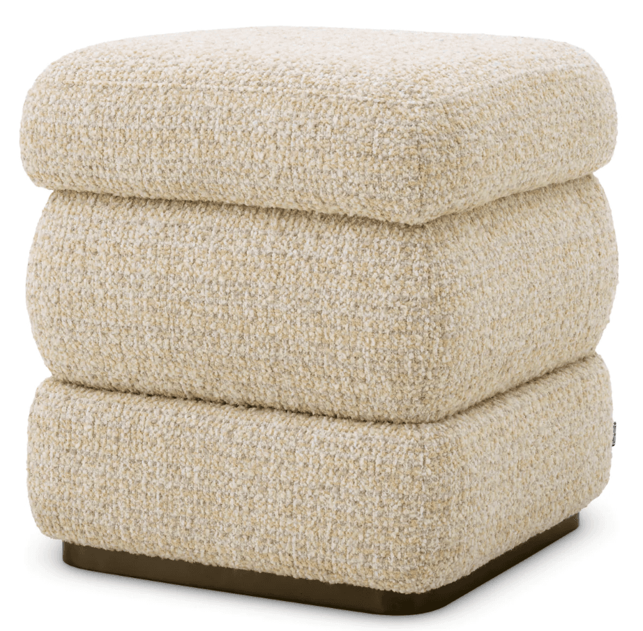A three-tiered ottoman with rounded edges, upholstered in a textured boucle fabric. The base is a dark, solid plinth. — 3D model