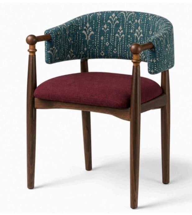 A stylish barrel back armchair featuring a dark stained wooden frame with tapered legs and turned arm supports. The backrest is upholstered in a teal fabric with an off-white geometric or floral pattern, while the seat cushion is upholstered in a solid maroon fabric, creating a striking contrast. The rounded back curves into short arms, supported by the turned wooden posts. — 3D model