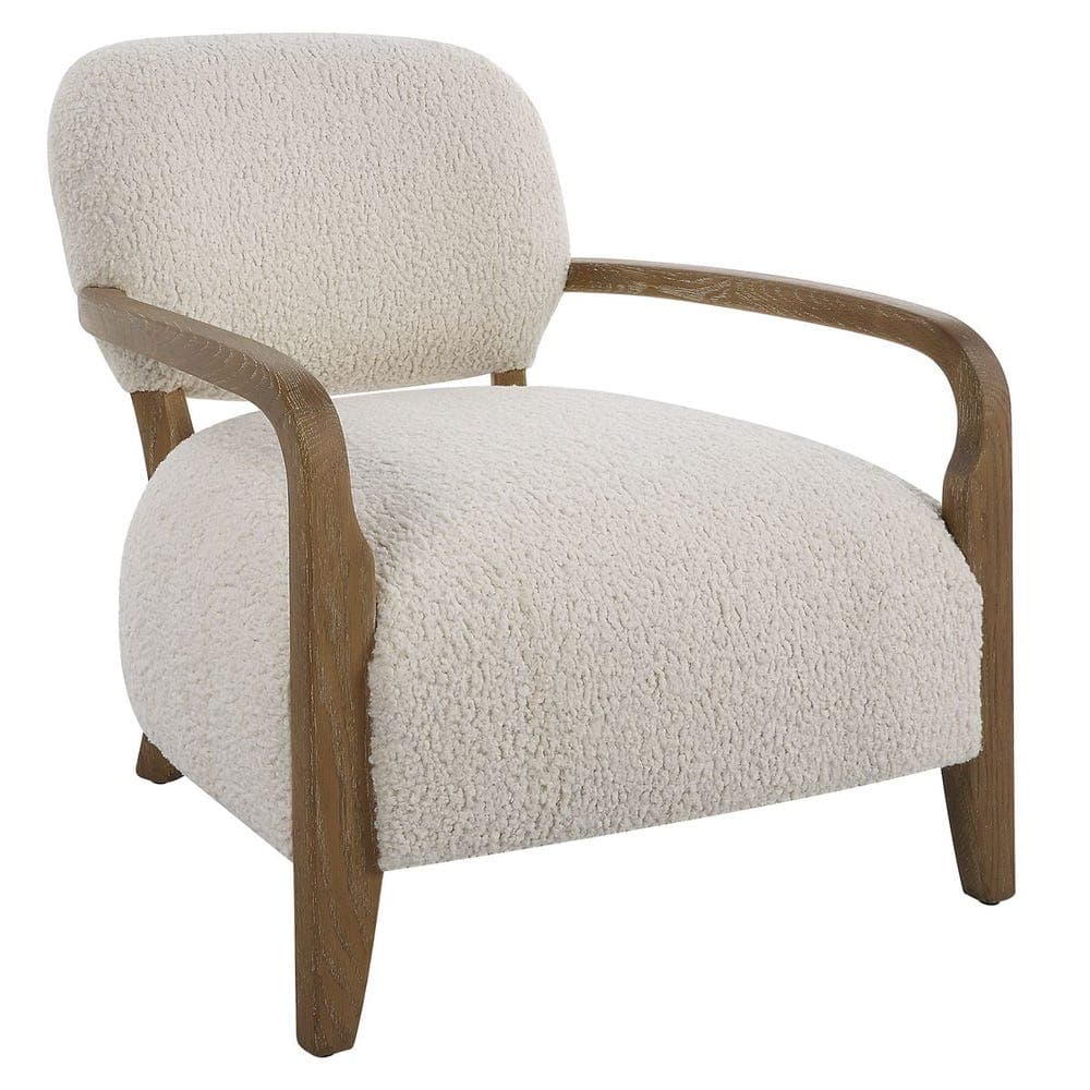 A comfortable armchair featuring a curved backrest and seat upholstered in a plush, textured cream-colored fabric. The armchair has a distinctive design with curved wooden armrests and legs that extend upwards to form the arm supports. The wood has a natural, light brown finish with visible grain. — 3D model