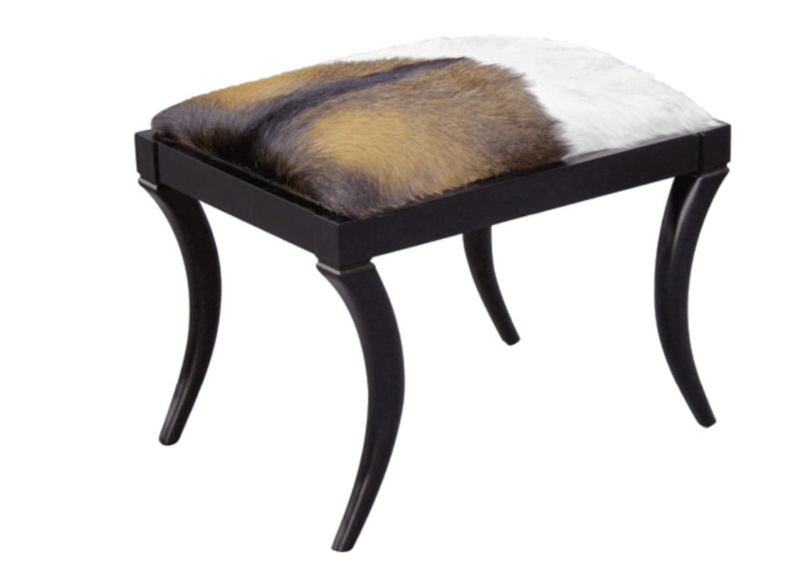 A small, rectangular stool featuring a cowhide upholstered top in natural brown, white, and black patterns, supported by four dark-finished, elegantly curved wooden legs in a cabriole style. — 3D model