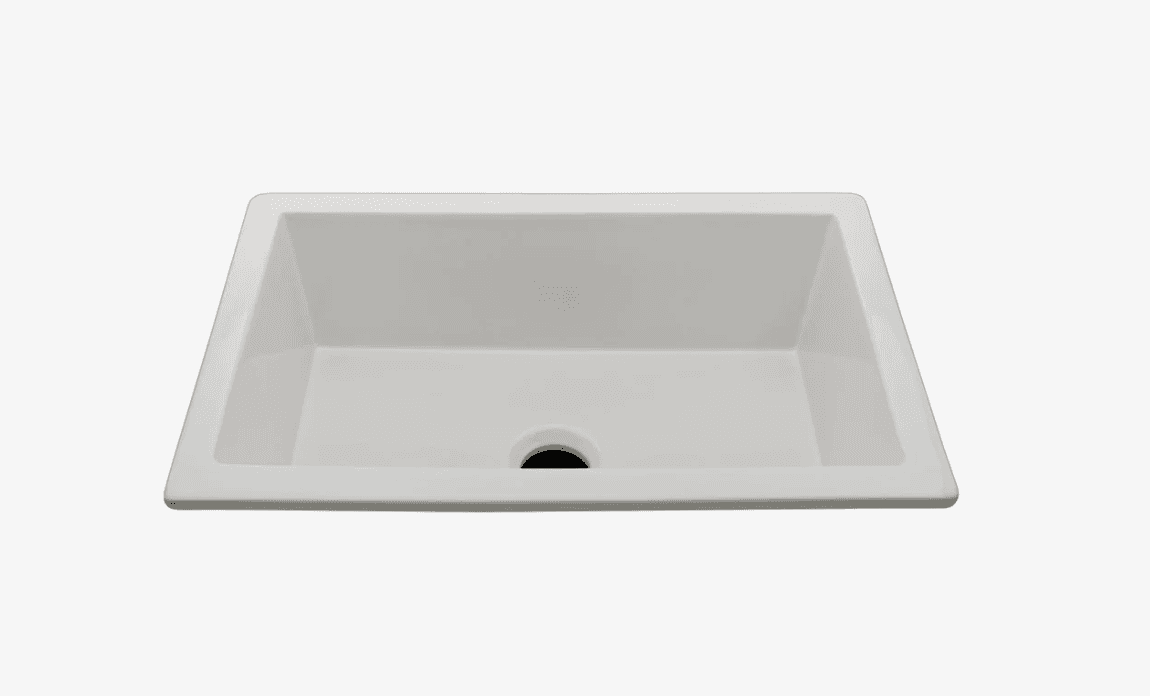 A white, rectangular sink with gently sloped sides and a central drain hole. The sink appears to be made of a solid surface material or porcelain, exhibiting a smooth, matte finish. It is designed for under-mount installation, with a rim that would sit below the countertop. — 3D model