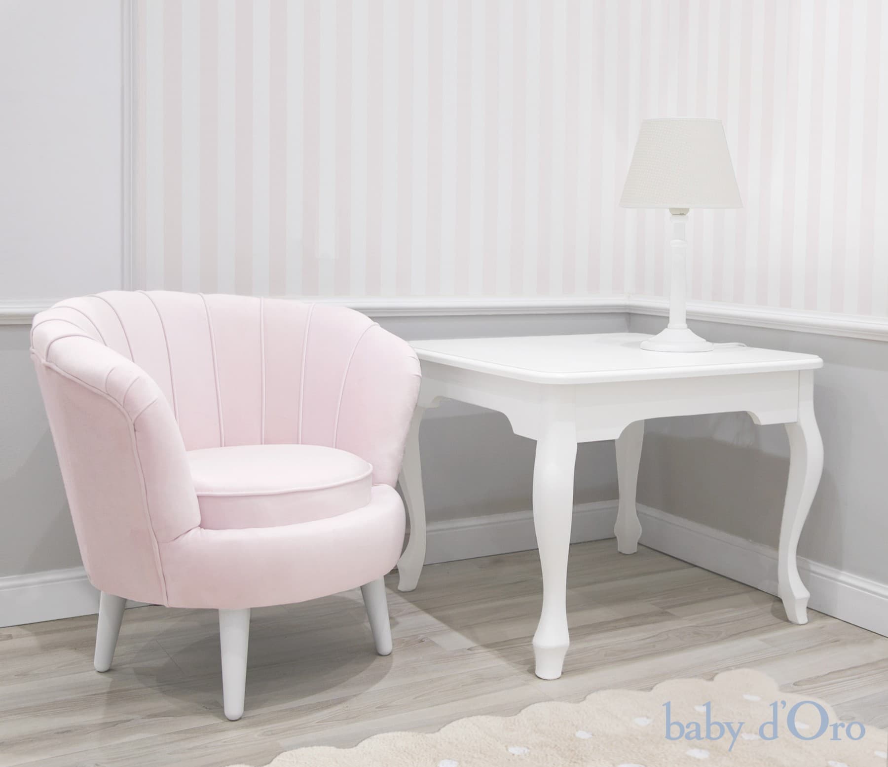 A light pink armchair with a scalloped backrest and a round seat cushion. The chair has four white, tapered legs. The upholstery appears to be a soft fabric, possibly velvet or a similar plush material. — 3D model