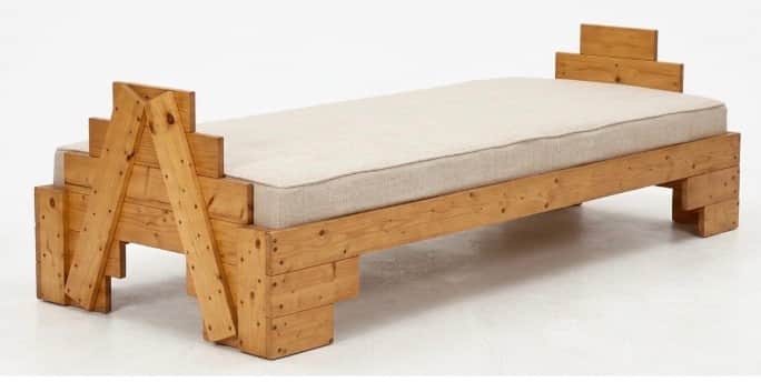 A rustic daybed or long bench, constructed from substantial, light-toned wooden planks. The frame fe… — 3D model