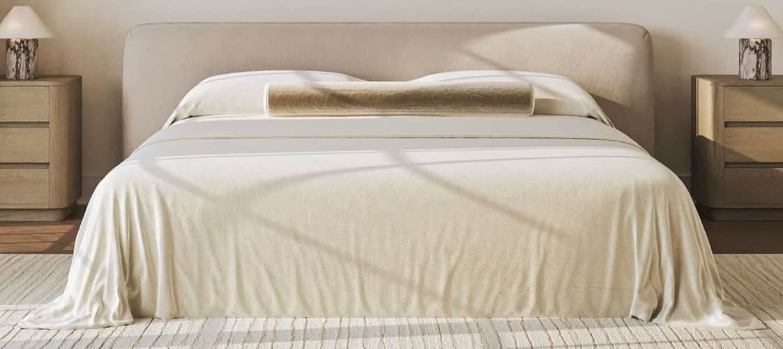 A modern upholstered platform bed with an integrated, gently rounded headboard, covered in a light b… — 3D model