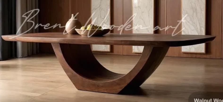 A modern coffee table with a dark wood finish, featuring a rectangular top with rounded edges supported by a distinctive, curved pedestal base. — 3D model