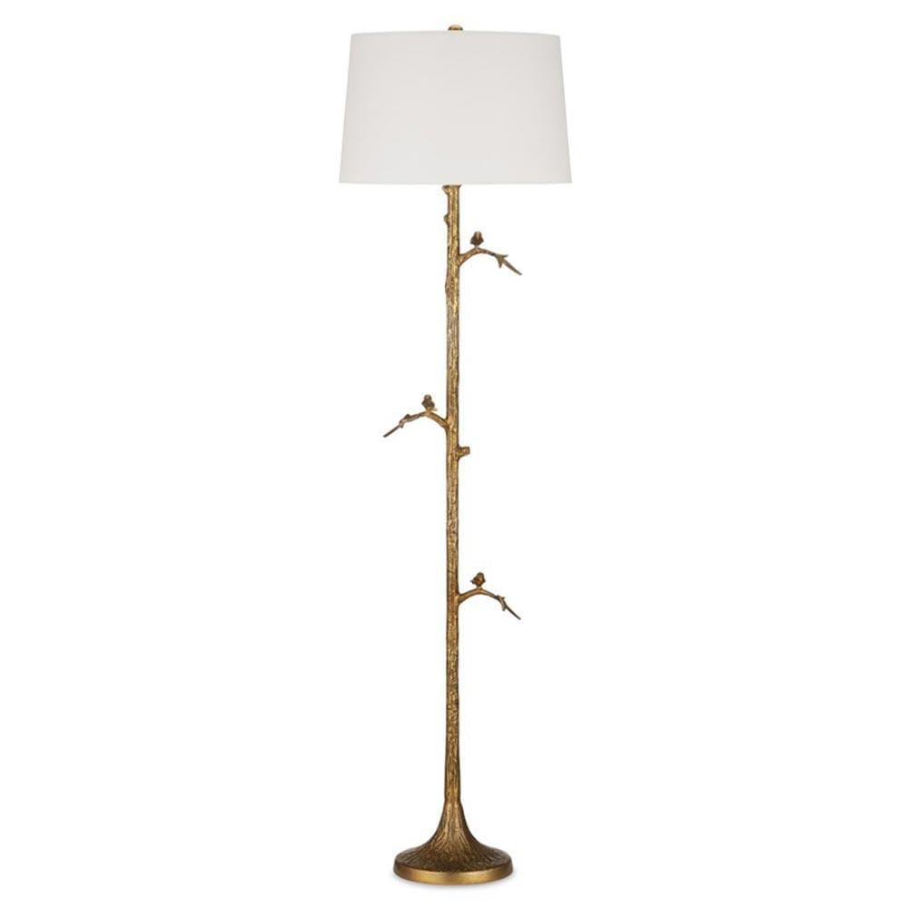 A tall, ornate floor lamp with a white drum lampshade. The lamp's stem is designed to resemble a tree branch, complete with textured detailing and small decorative bird figures. The base is round and features a textured, possibly relief, pattern. The overall aesthetic suggests a nature-inspired, decorative piece. — 3D model