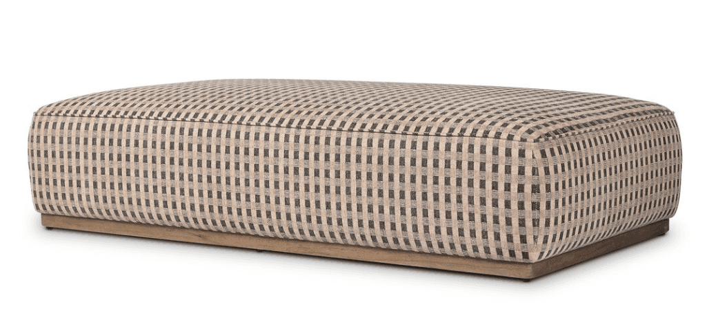 A rectangular upholstered ottoman featuring a black and light beige checkered fabric pattern and res… — 3D model