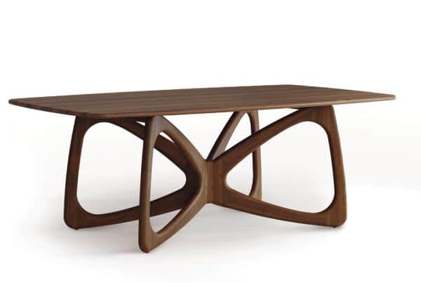 A coffee table with a rectangular tabletop and an intricate, sculptural base. The base is composed o… — 3D model