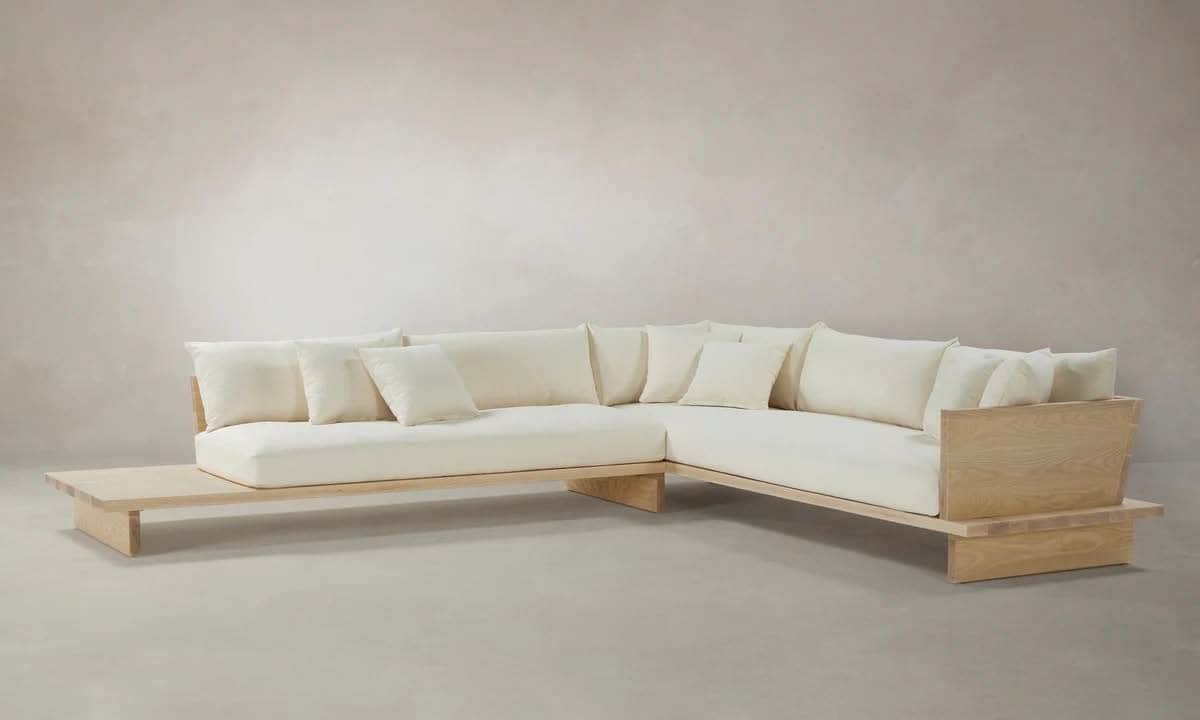 A modular sectional sofa with a low-profile design. The frame appears to be constructed from light-c… — free OBJ 3D model