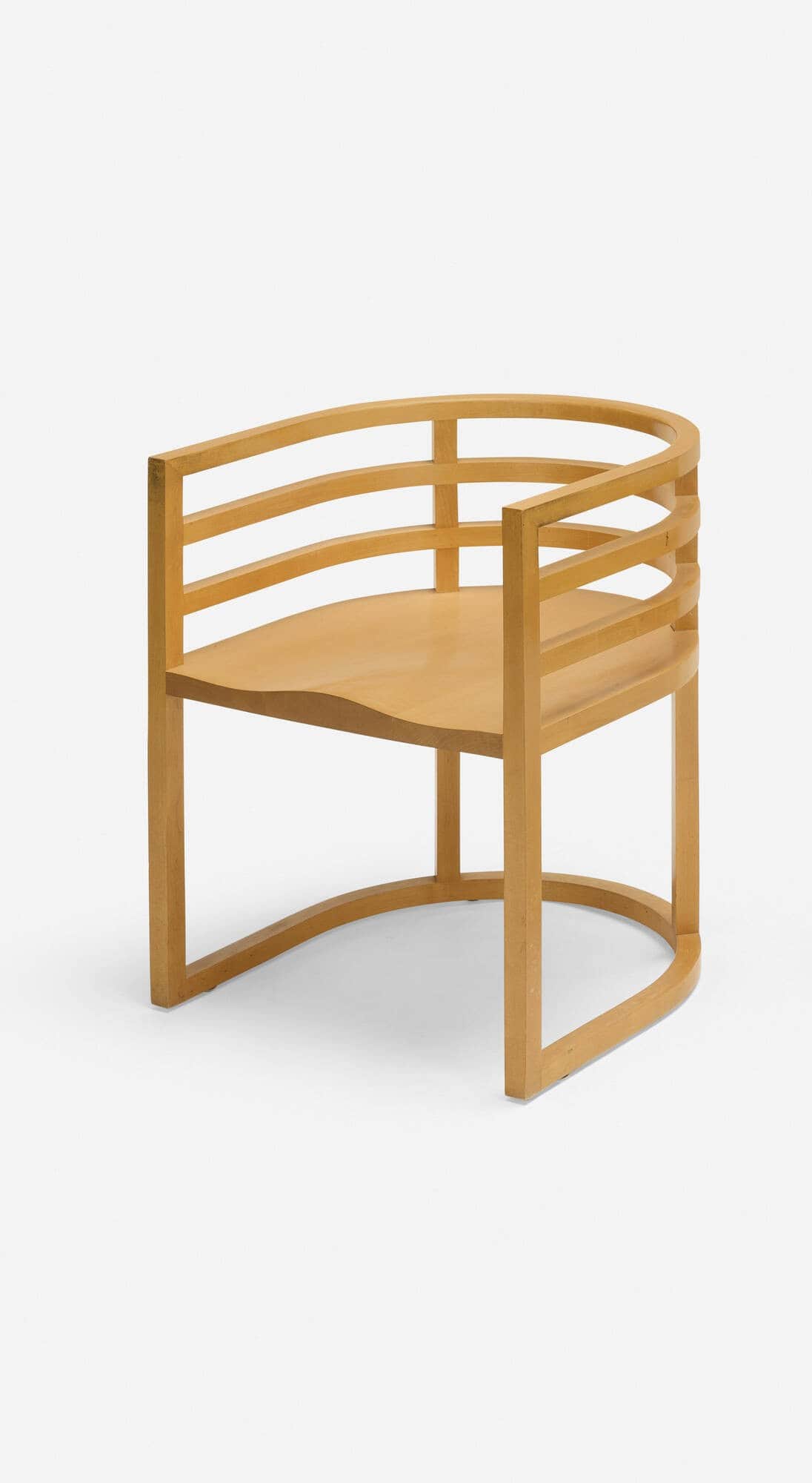 A wooden armchair with a curved backrest composed of horizontal slats and a solid seat. The chair fe… — free OBJ 3D model
