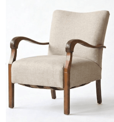 A traditional upholstered armchair with an exposed wooden frame and carved armrests. The chair features a padded seat and backrest covered in a light beige woven fabric. The wooden frame is finished in a warm, medium-brown tone, and the armrests have decorative leaf or scroll carvings. — 3D model