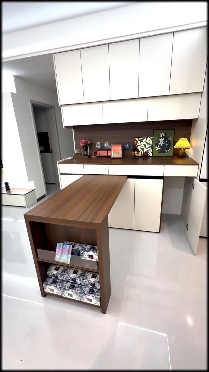 A dark brown wood-grain desk featuring a long, rectangular cantilevered top surface supported by an integrated shelving unit with two open shelves. — 3D model