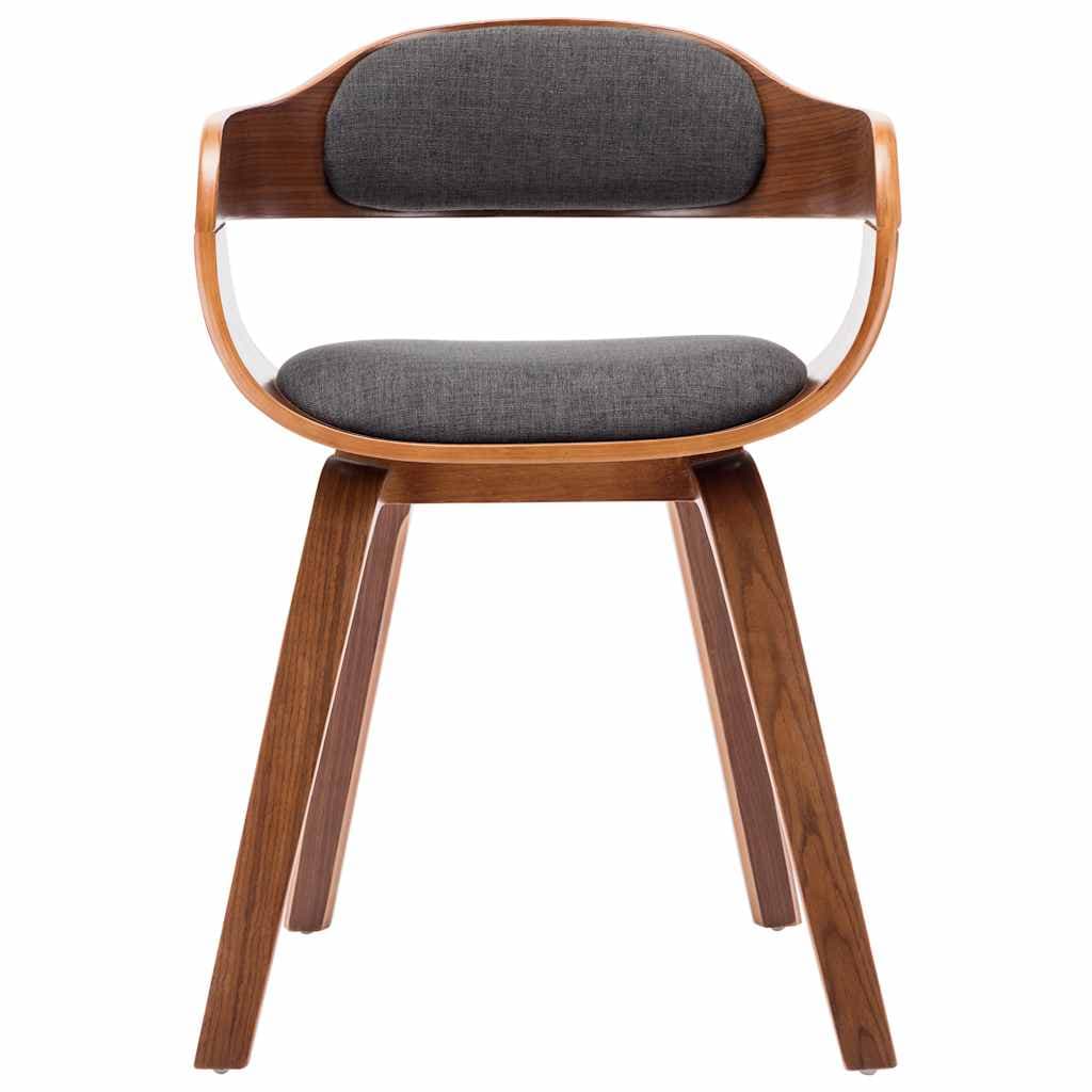 A contemporary accent chair with a curved, molded wooden frame and upholstered seat and backrest. The chair features a low profile and a distinctive silhouette created by the continuous wooden armrests that blend into the backrest. The base consists of four tapered wooden legs, angled outwards for stability. — 3D model