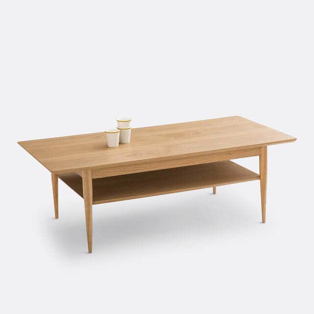 A rectangular coffee table constructed from natural oak wood, featuring a spacious tabletop and a fu… — 3D model
