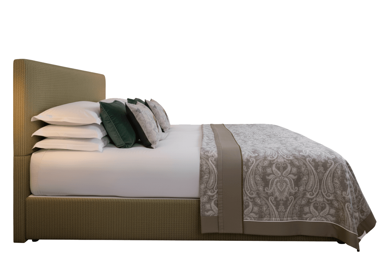 A side profile view of a bed with a fabric-covered headboard and frame. The bed is made with white sheets, layered pillows (some decorative with dark green and patterned covers), and a decorative throw blanket with a damask pattern in neutral tones. The frame and headboard appear to be upholstered with a ribbed fabric. — 3D model