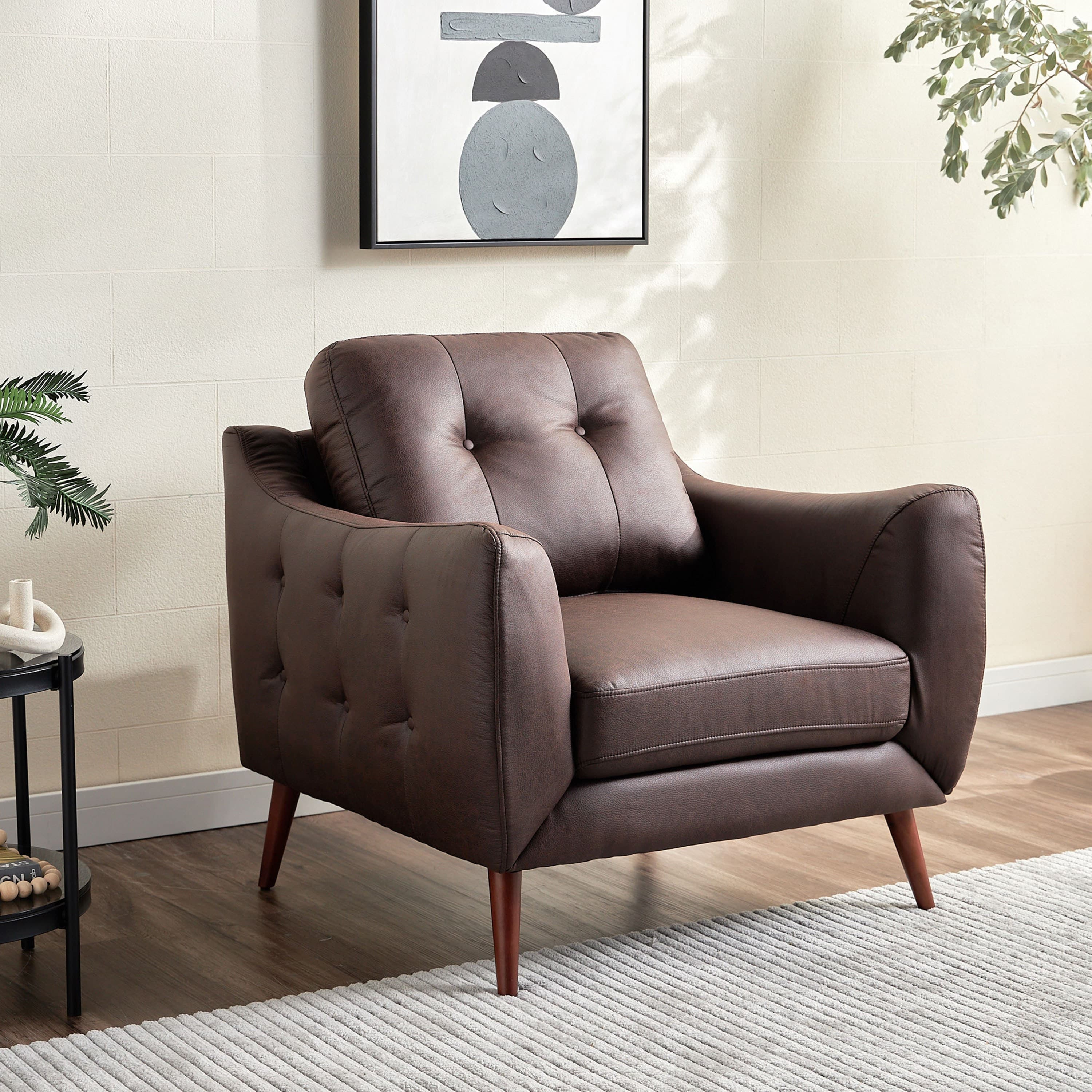 A dark brown tufted armchair with a mid-century modern aesthetic, upholstered in leather or faux leather and supported by tapered wooden legs. — 3D model
