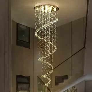 A luxurious modern chandelier featuring a gold-finished ceiling mount from which multiple strands of… — free OBJ 3D model