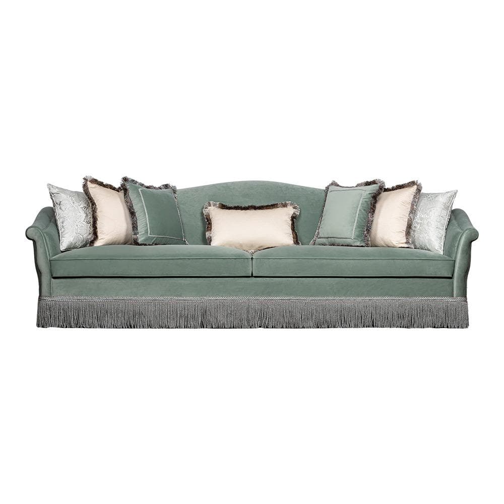 A traditional style three-seater sofa upholstered in a mint green velvet fabric. It features rolled arms, a gently curved camelback-style backrest, and a distinctive fringe skirt along the bottom. The sofa is adorned with several decorative throw pillows in coordinating shades of green, cream, and white, some with fringed edges. — 3D model