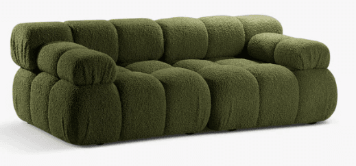 A modular sofa with a rounded, bulbous design. The sofa is upholstered in a textured, shaggy fabric and features deep tufting or segmentation across its seat and back cushions. It appears to be a low-profile piece with substantial volume. — 3D model