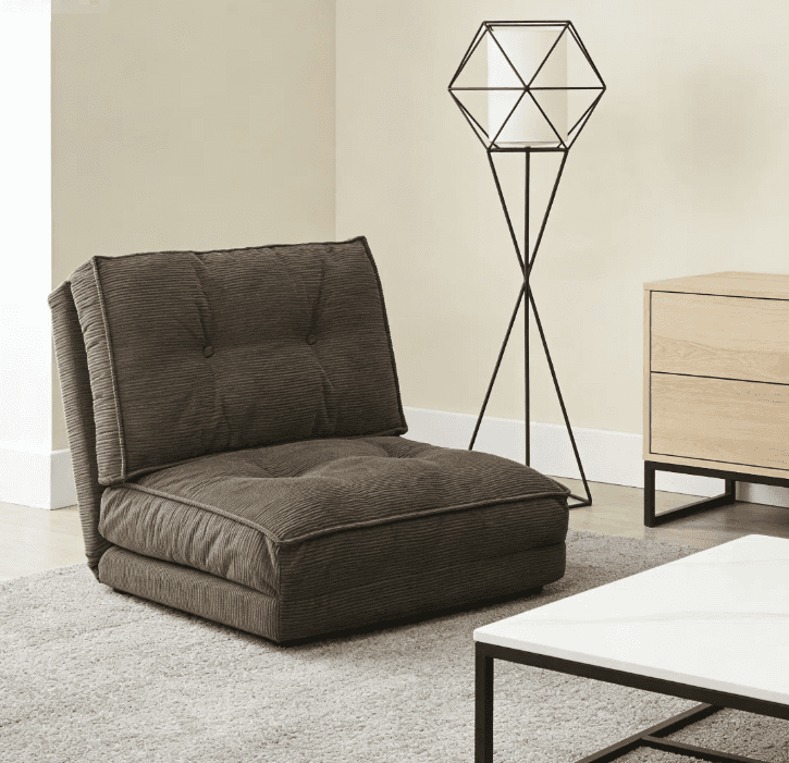 A low-profile, brown corduroy floor lounge chair featuring button-tufted detailing on both its seat… — 3D model