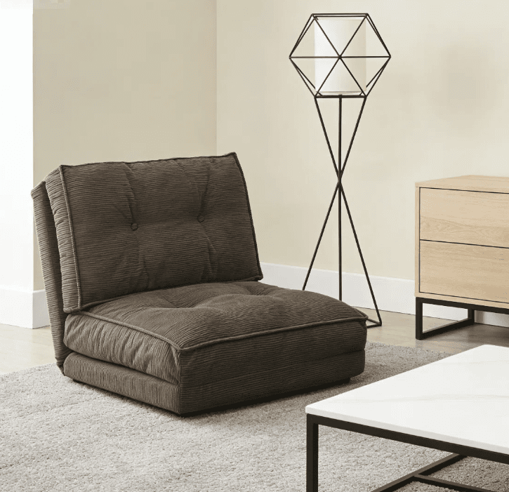 A low-profile, brown corduroy floor lounge chair featuring button-tufted detailing on both its seat and backrest, designed for casual, comfortable seating. — 3D model