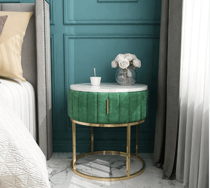 A round side table featuring a white marble top, a channel-tufted emerald green velvet body with a pull handle, and a gold-finished metal open-frame base. — 3D model
