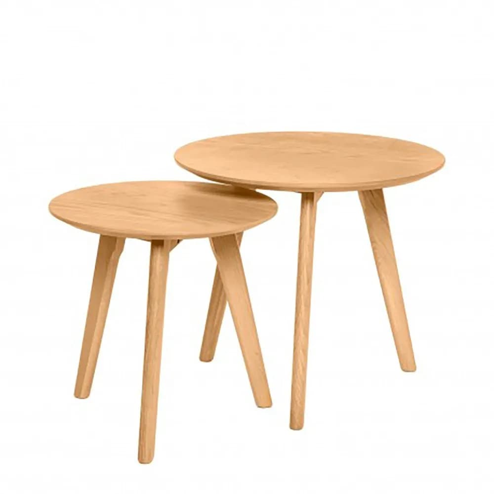 A set of two nesting tables with round tops and tapered legs. The larger table is positioned behind and slightly to the right of the smaller table, with its top extending over the smaller one. Both tables feature a light wood grain and a minimalist design. — 3D model
