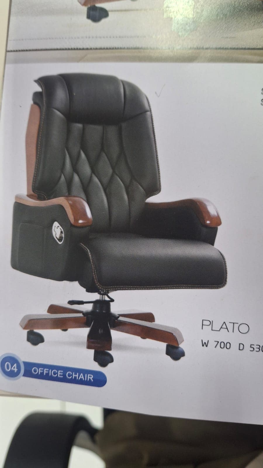 An executive swivel office chair featuring black padded upholstery, wooden armrests, and a five-star wooden base with casters. The backrest has a quilted pattern, and the chair appears designed for comfort and professional aesthetics. — 3D model