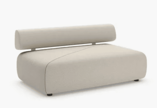 An armless, modular lounge seating unit featuring a plush, rounded base upholstered in a light, neutral fabric. The backrest is a separate, cylindrical cushion supported by a horizontal metal bar, giving it a floating appearance. The design is contemporary and minimalist, with a subtle seam detail across the seat. The unit rests on small, discreet dark feet. — 3D model