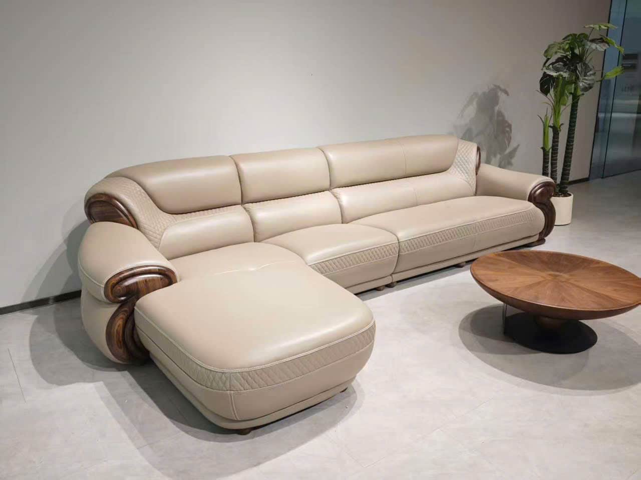 An L-shaped sectional sofa featuring cream-colored upholstery, likely leather or high-quality faux l… — 3D model