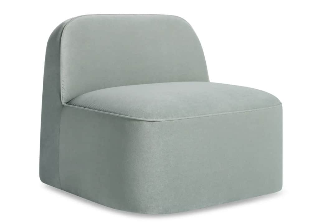 A single-seater armchair with a low profile and a rounded backrest. The upholstery appears to be a s… — 3D model