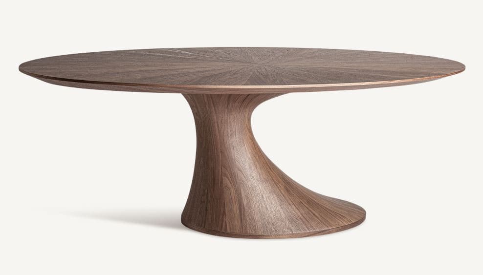 A modern dining table with a distinctive sculptural pedestal base. The tabletop is oval and features a radial wood grain pattern. The base is organically shaped, widening towards the bottom for stability. — 3D model