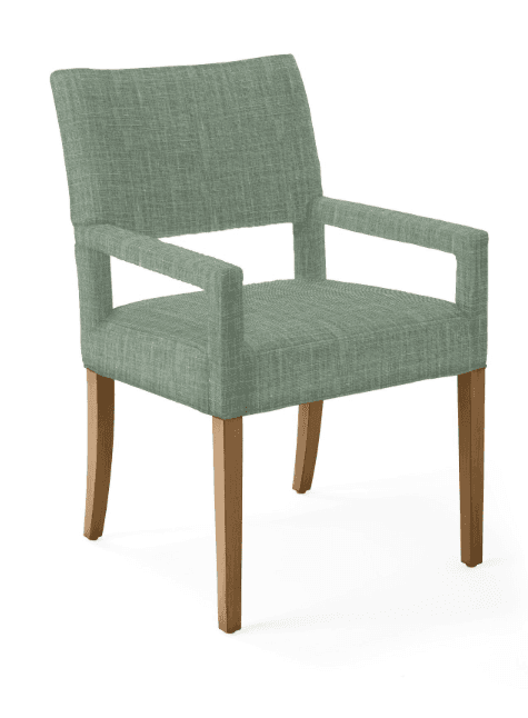 A fully upholstered armchair with four wooden legs. The chair features a straight backrest that curves slightly outward at the top, and integrated armrests that are open at the sides. The upholstery has a visible woven texture. The legs are tapered and angled slightly outwards. — 3D model