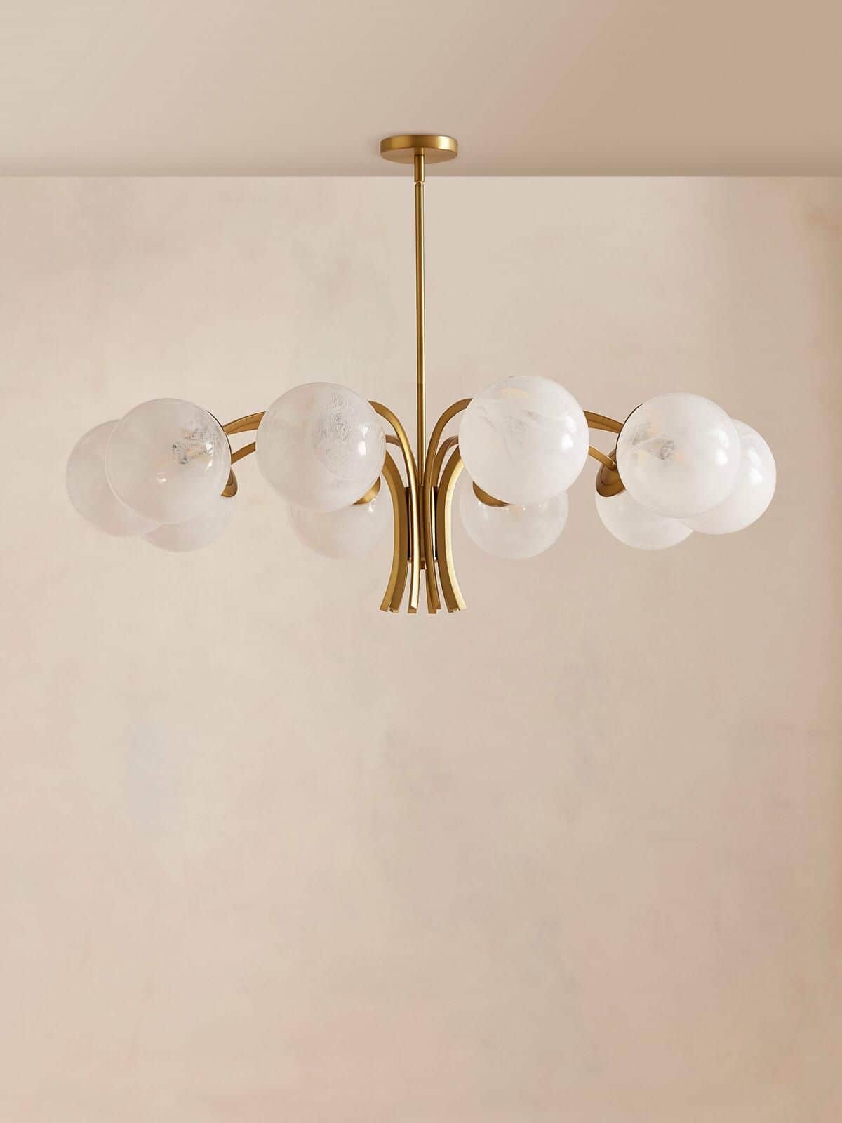 A contemporary chandelier featuring a gold-toned brass frame with a central stem from which multiple… — free GLB 3D model