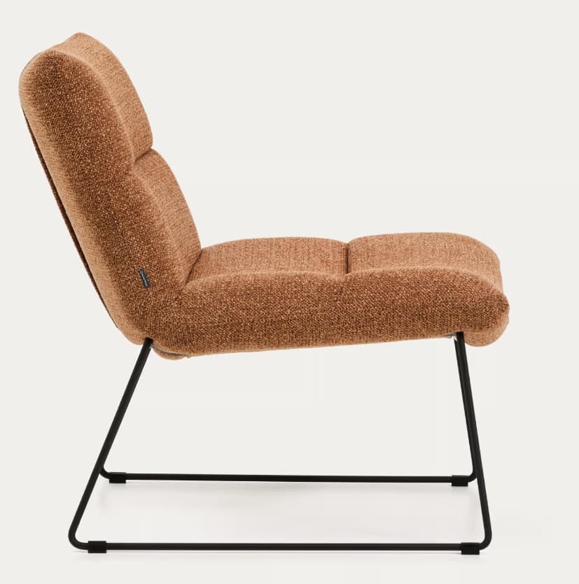 An armless lounge chair featuring a low-slung, ergonomic design. The chair is fully upholstered in a textured, terracotta brown fabric, with segmented cushions forming the backrest and seat. It rests on a minimalist black powder-coated metal sled base, giving it a contemporary aesthetic. The overall profile suggests comfort and relaxation. — 3D model