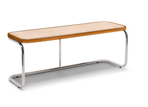 A long, narrow bench with a wooden frame and a woven cane seat. The bench is supported by tubular metal legs in a cantilevered design. — 3D model