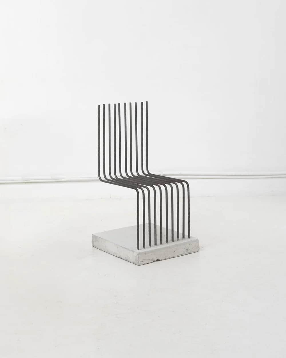 A contemporary chair constructed from multiple parallel steel rods forming the seat and backrest, an… — 3D model