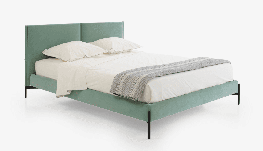 A modern upholstered bed frame with a rectangular headboard and a low-profile footboard. The bed is covered in a light green fabric and supported by thin black metal legs. It is dressed with white bedding and a grey striped throw blanket. — 3D model