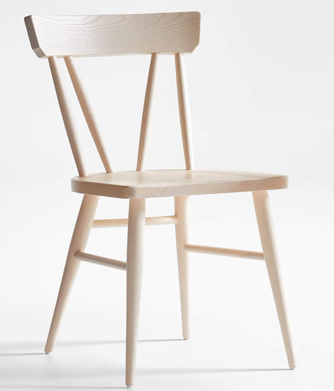 A light-colored wooden dining chair featuring a contoured seat, a broad, gently curved backrest with… — 3D model