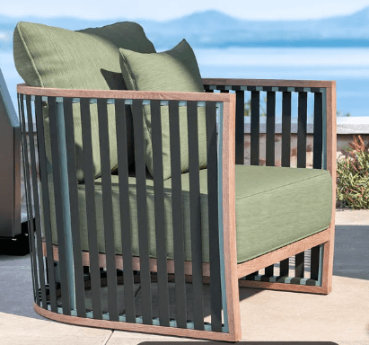 A contemporary armchair with a curved frame and slatted sides. The armchair features a wooden base a… — free OBJ 3D model