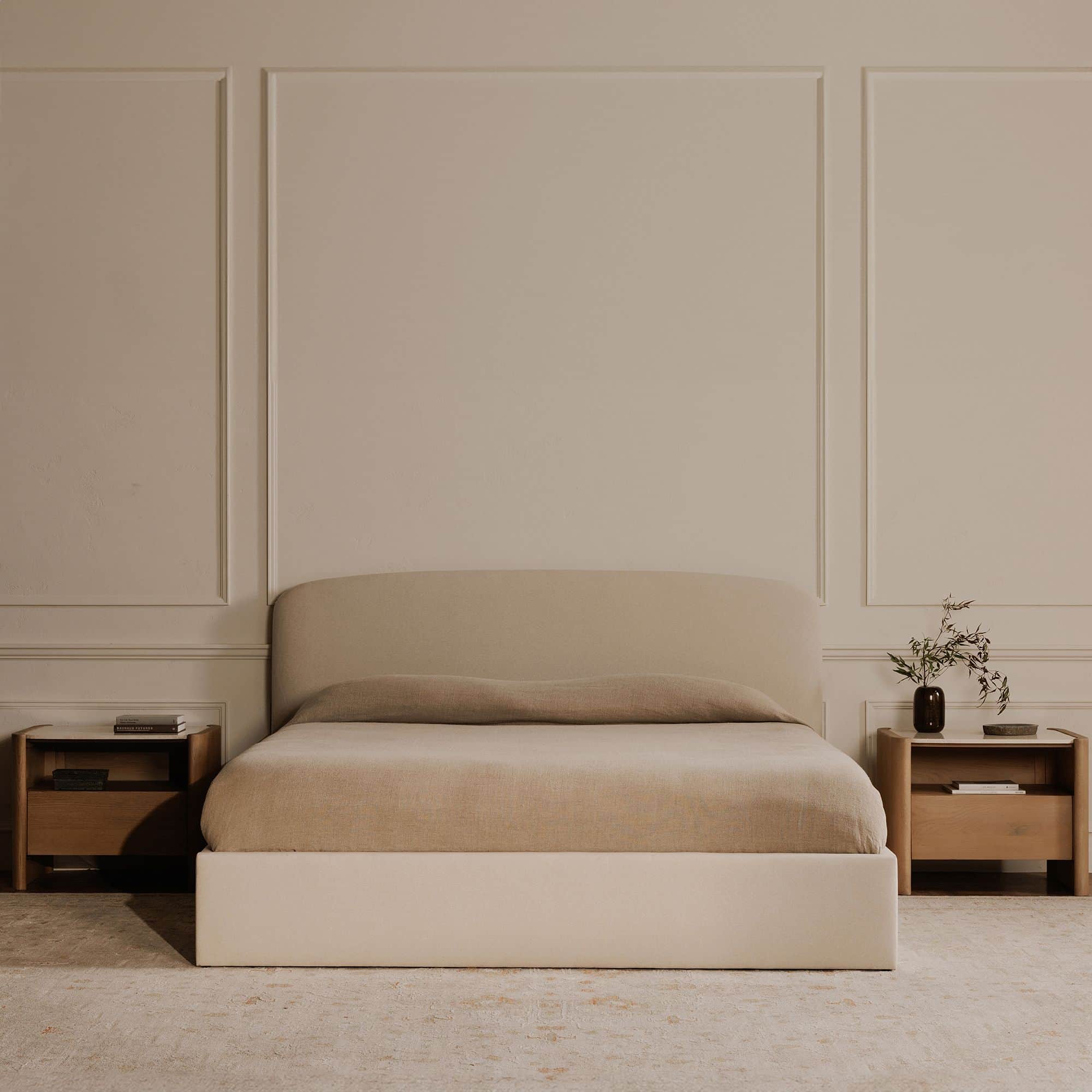 A modern platform bed with a gently curved, upholstered headboard and a rectangular, upholstered bas… — 3D model