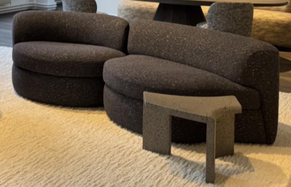 A dark grey, upholstered, curved modular sofa piece with an organic, contemporary design. — 3D model