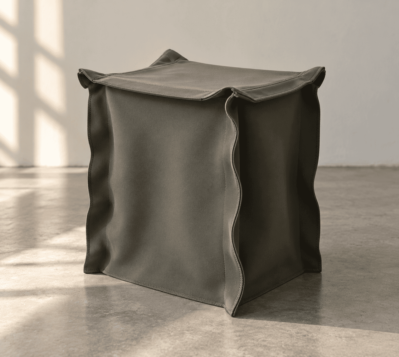 A precisely rendered cube-shaped ottoman, upholstered in a uniform dark olive green fabric, featurin… — 3D model