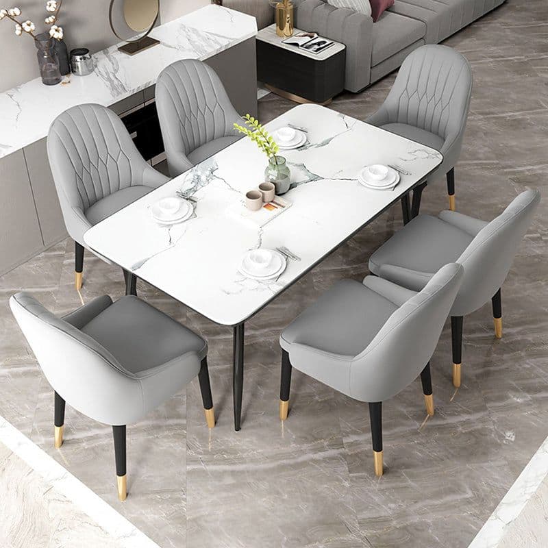 A modern dining set consisting of a rectangular table with a white marble-patterned top and six grey upholstered dining chairs, some with vertical channel tufting. — 3D model