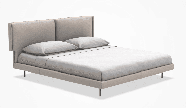 A contemporary upholstered bed frame with a two-panel headboard and low-profile base. The bed is dressed with white linens and two pillows. It is supported by four slender, dark metal legs. — 3D model