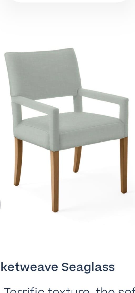 A light blue upholstered armchair with four wooden legs. The armchair has a rectangular backrest and armrests, and the legs are tapered. — 3D model