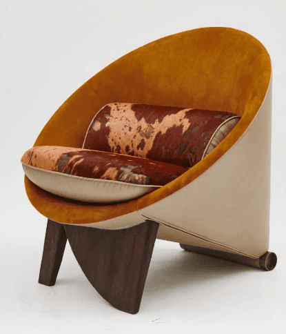 An distinctive lounge chair featuring a deep, curved shell form. The interior of the shell is uphols… — free OBJ 3D model